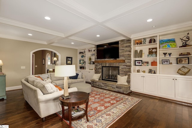 living room featuring built in features, a fireplace, coffered ceiling, dark wood-type flooring, and beam ceiling