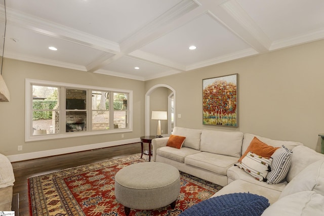 living room with crown molding, hardwood / wood-style flooring, coffered ceiling, and beamed ceiling