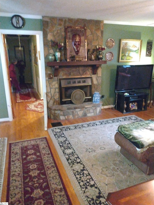 living room featuring hardwood / wood-style floors and a fireplace