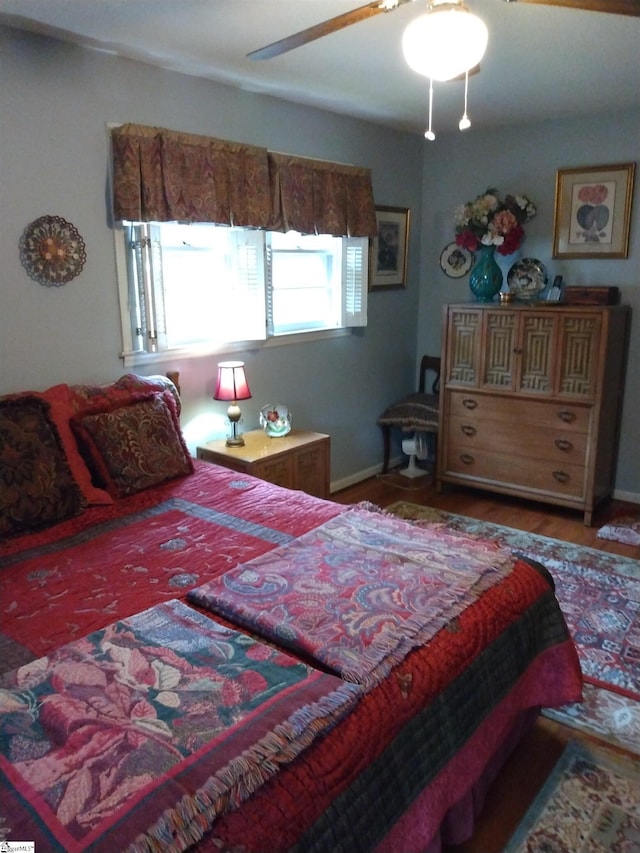 bedroom featuring ceiling fan and wood-type flooring