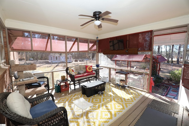 sunroom featuring ceiling fan