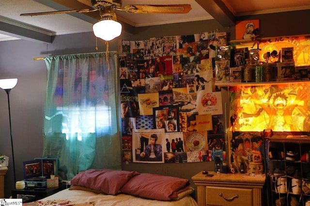 bedroom featuring beamed ceiling, crown molding, and ceiling fan