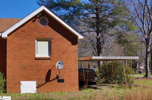 view of side of home featuring a carport