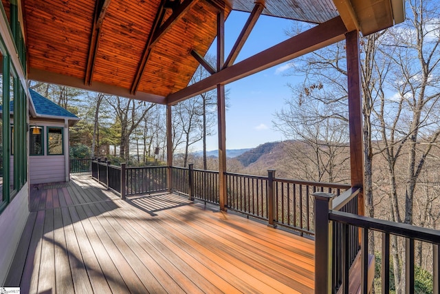 wooden deck with a mountain view