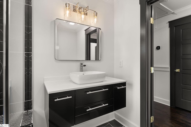 bathroom with vanity and ornamental molding