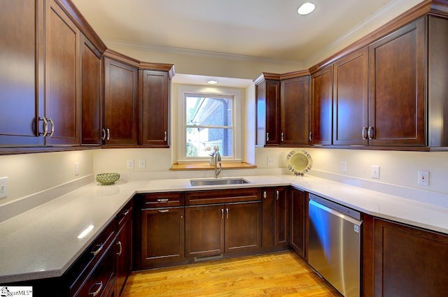 kitchen with dishwasher, ornamental molding, sink, and light wood-type flooring