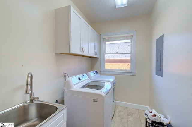 washroom with cabinets, sink, electric panel, and independent washer and dryer