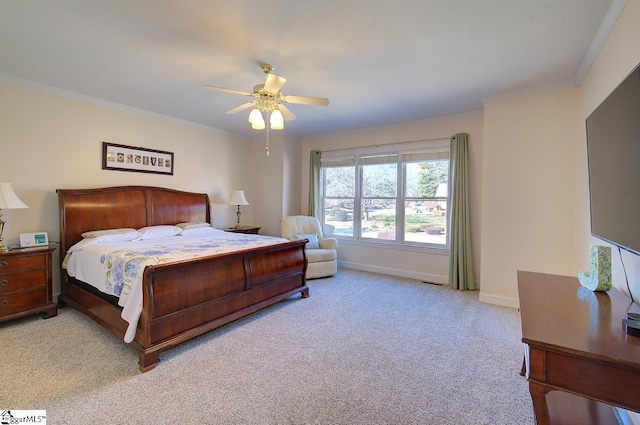 carpeted bedroom featuring crown molding and ceiling fan