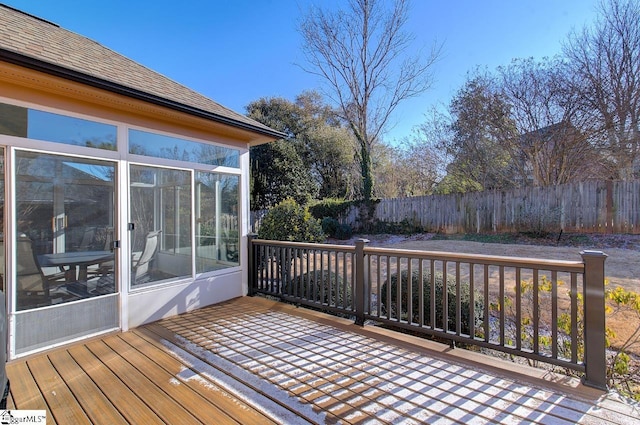 wooden terrace featuring a sunroom