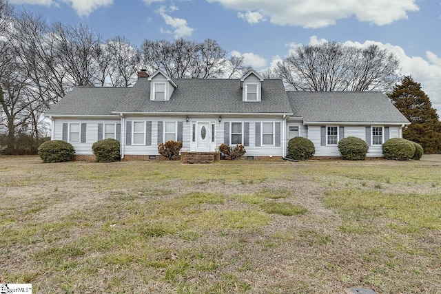 new england style home featuring a front lawn