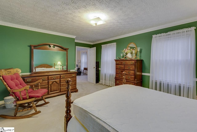 carpeted bedroom featuring ornamental molding and a textured ceiling