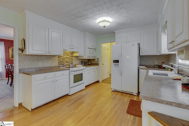 kitchen featuring white cabinetry, white appliances, sink, and backsplash