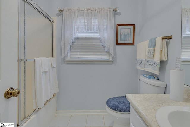 full bathroom with vanity, tile patterned floors, shower / bath combination with glass door, and toilet