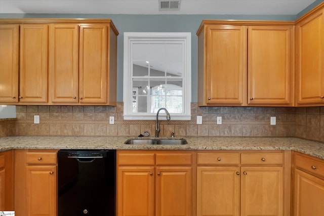 kitchen with decorative backsplash, dishwasher, sink, and light stone countertops