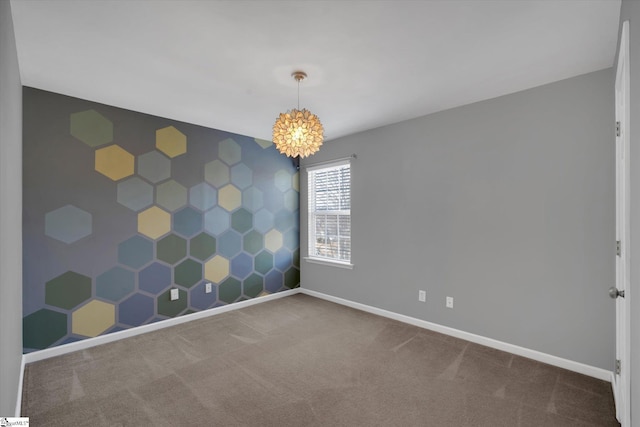 carpeted empty room with a chandelier