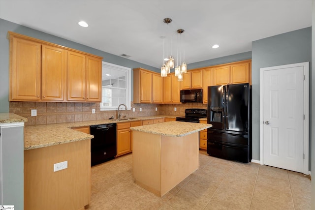 kitchen featuring a kitchen island, decorative light fixtures, sink, backsplash, and black appliances