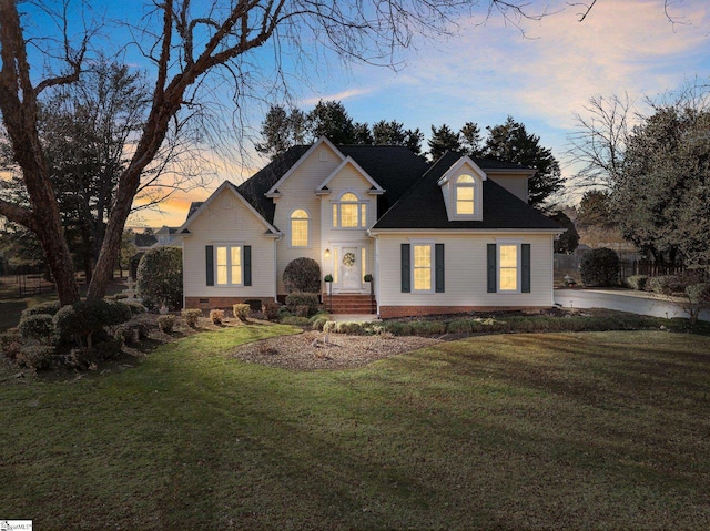 view of front of home featuring a lawn