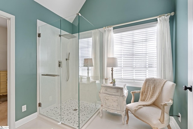 bathroom with tile patterned flooring and an enclosed shower