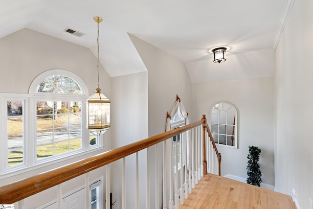 hall featuring vaulted ceiling