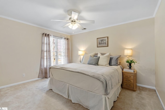 bedroom featuring ornamental molding, light colored carpet, and ceiling fan