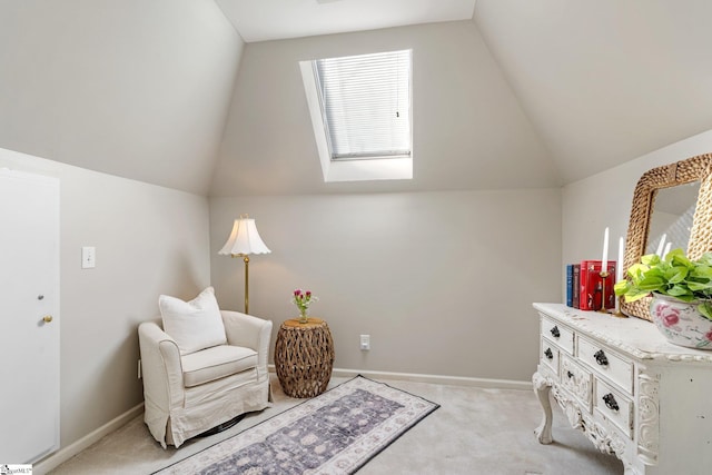 sitting room featuring light colored carpet and lofted ceiling