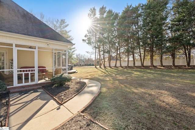 view of yard featuring a sunroom