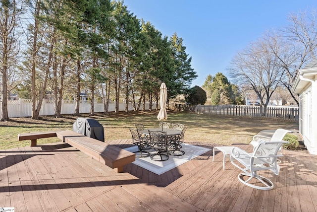 deck with a yard and grilling area