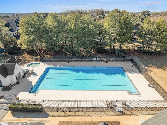 view of pool featuring an in ground hot tub and a patio area