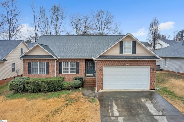 view of front of house featuring a garage and a front yard