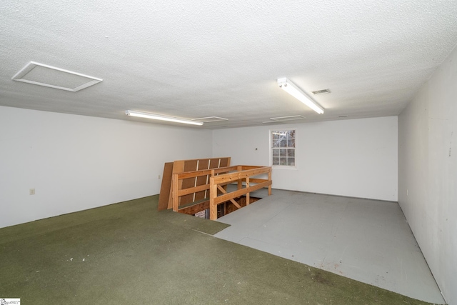 basement with a textured ceiling