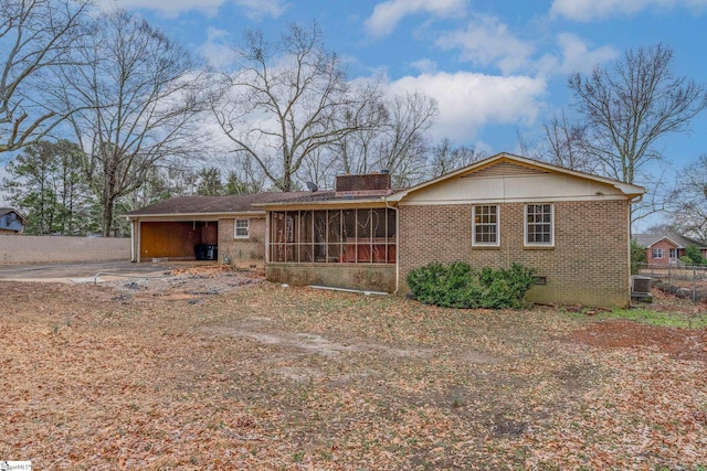 view of front of home with a sunroom