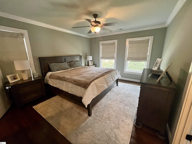 bedroom featuring dark hardwood / wood-style flooring, crown molding, and ceiling fan