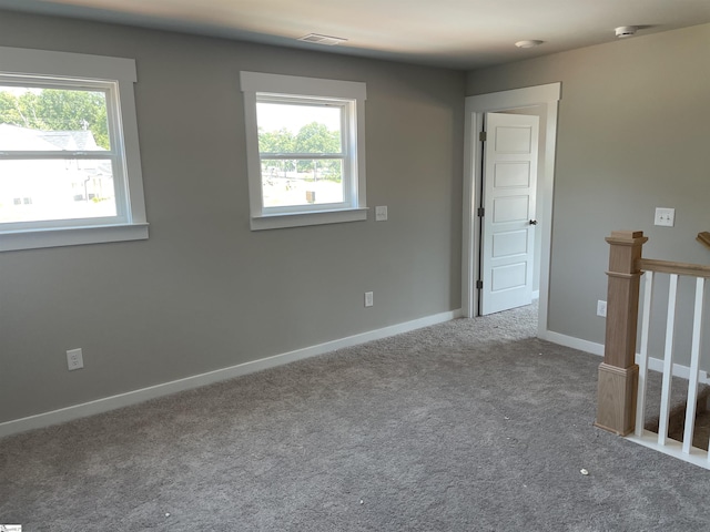 empty room with carpet flooring