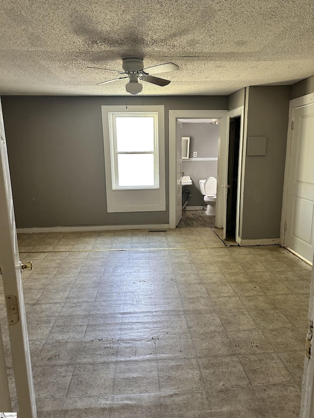 unfurnished room with ceiling fan