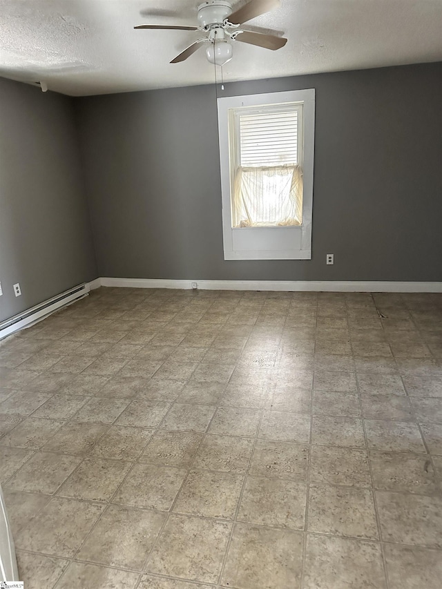 spare room with ceiling fan, a baseboard radiator, and a textured ceiling