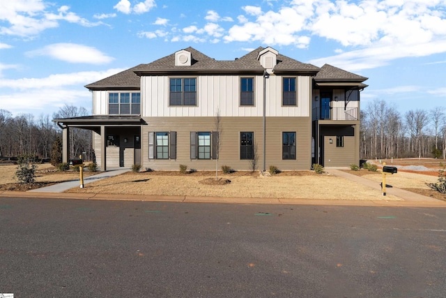 view of front of property with a balcony