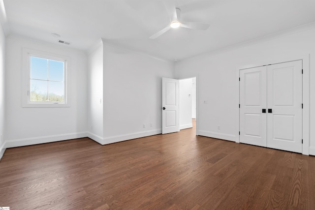 unfurnished bedroom with wood-type flooring, ornamental molding, and ceiling fan