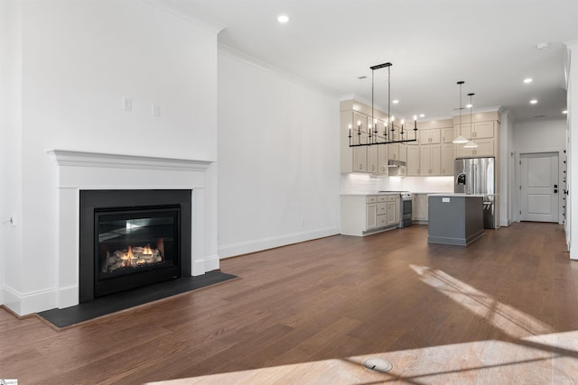 unfurnished living room with dark wood-type flooring and ornamental molding