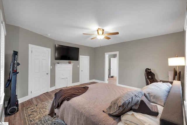 bedroom featuring hardwood / wood-style flooring and ceiling fan