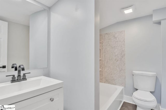 bathroom featuring vanity, tile patterned floors, and toilet