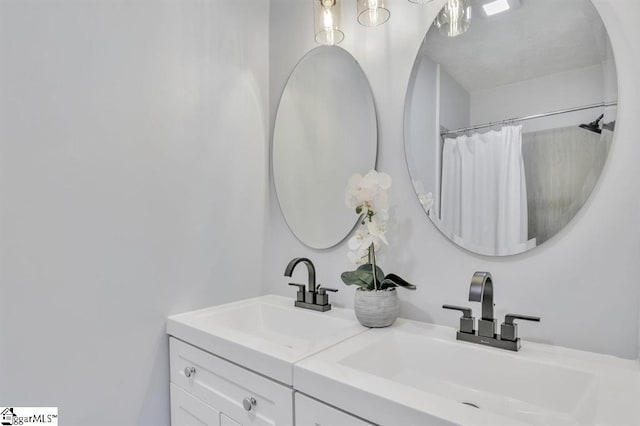 bathroom with vanity and curtained shower