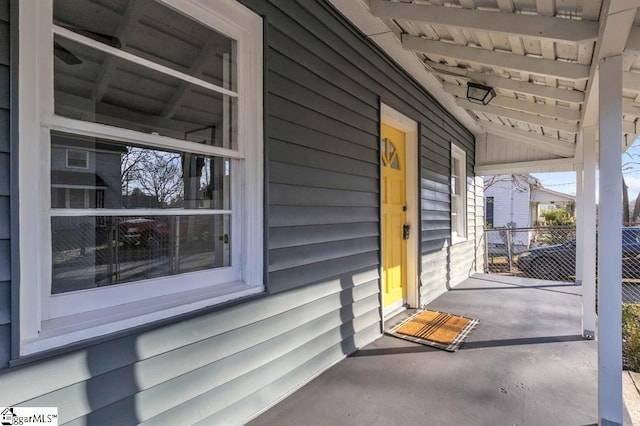 doorway to property with covered porch