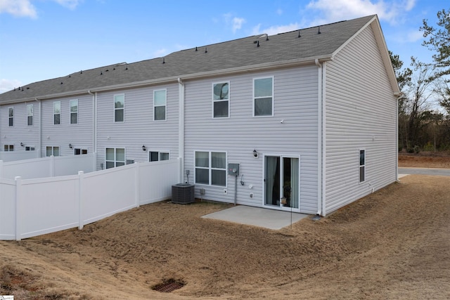 back of house with central AC and a patio