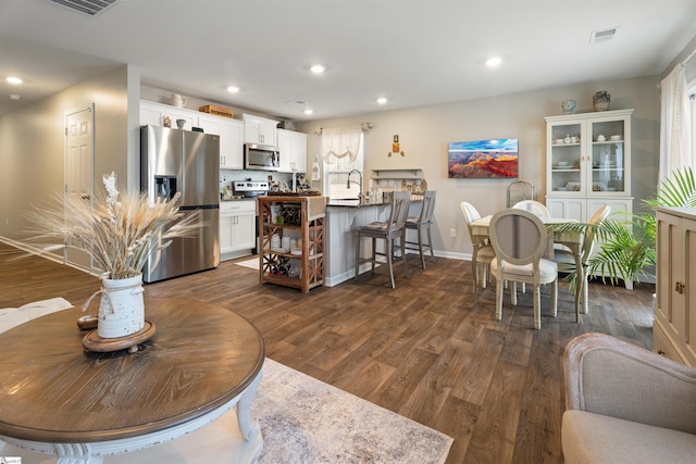 living room with dark hardwood / wood-style floors