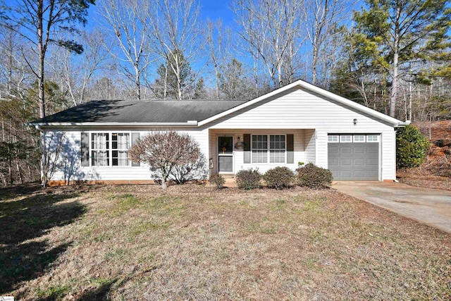 ranch-style home with a garage and a front lawn