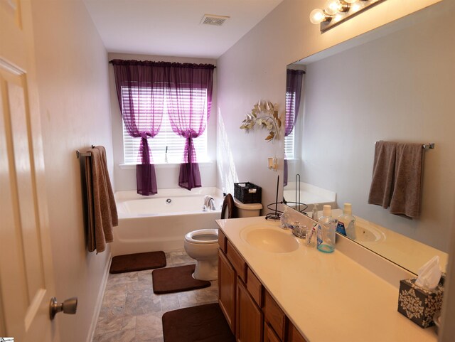 107 Montauk Dr, Greenville, SC 29607 - bathroom featuring vanity, a washtub, and toilet