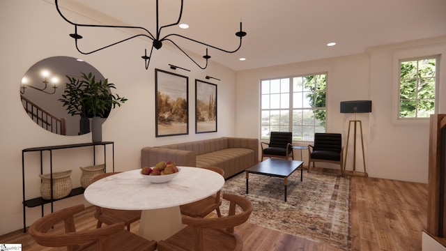 living room with ornamental molding and light wood-type flooring