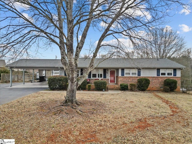 ranch-style house with a carport