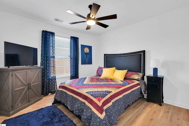 bedroom featuring ceiling fan and light hardwood / wood-style flooring