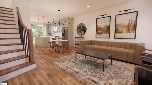 living room featuring sink, crown molding, radiator, a chandelier, and light wood-type flooring